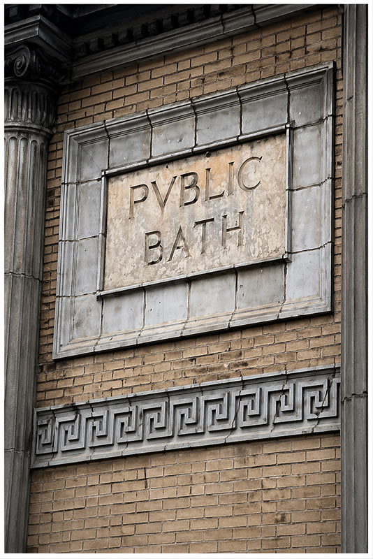 an old Roman style public bath sign